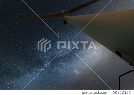 The Milky Way and the wind generator are arranged in the background of the blue night sky The Milky Way and the wind generator are arranged in the background of the blue night sky 50532595