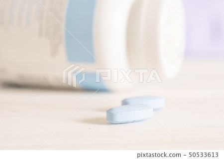 Blue medical pills in a hospital 50533613