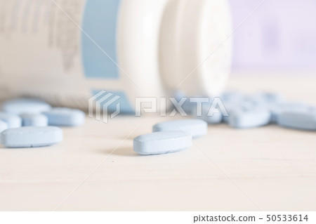 Blue medical pills in a hospital 50533614