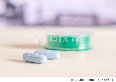 Blue medical pills in a hospital 50533624