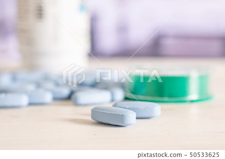 Blue medical pills in a hospital 50533625