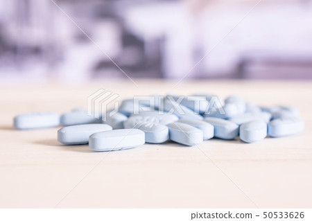 Blue medical pills in a hospital 50533626