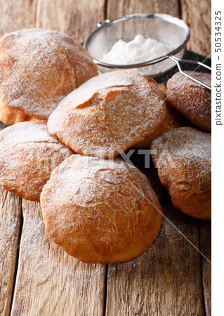 Bunuelos Mexican fritters sprinkled with powdered 50534325