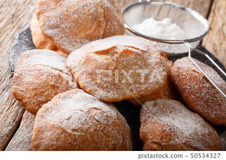 Sweet deep-fried Bunuelos sprinkled with powdered 50534327