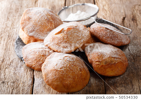 Bunuelos homemade donuts sprinkled with powdered 50534330