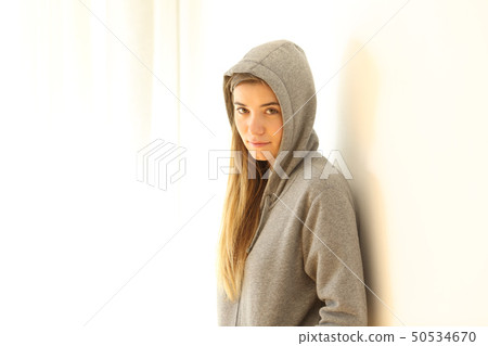 Portrait of a serious teen looking at camera 50534670