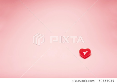 Red valentine heart model on pink background Red valentine heart model on pink background 50535035
