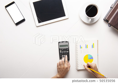 Top view of tablet, smartphone, calculator 50535056