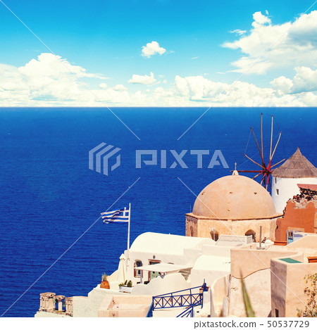 Santorini landscape with greek flag, white houses 50537729