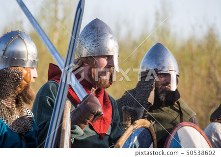Slav warriors in reenactment battle Slav warriors in reenactment battle 50538602