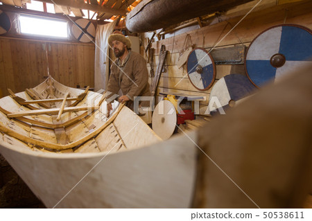 Wooden boat in the barn Wooden boat in the barn 50538611