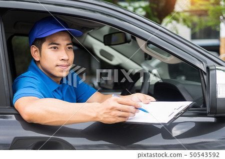 Delivery man checking document list on clipboard 50543592