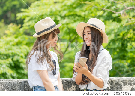 Two women traveling 50545083