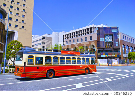 Sightseeing tour bus running on the Universal Bridge intersection in Yokohama Minatomirai area 50546250