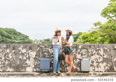 Two women traveling 50546359