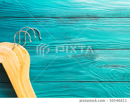 Wooden hangers with no clothes on green 50546811