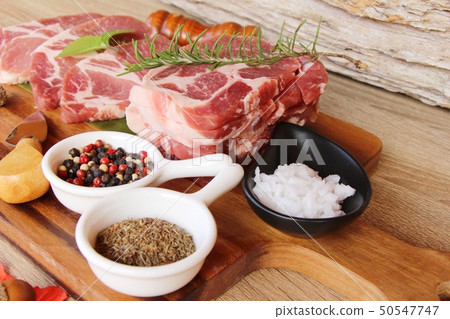 Raw pork steaks with salt and pepper 50547747