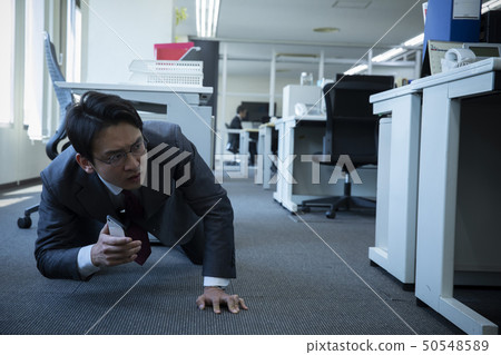 Business man hiding 50548589