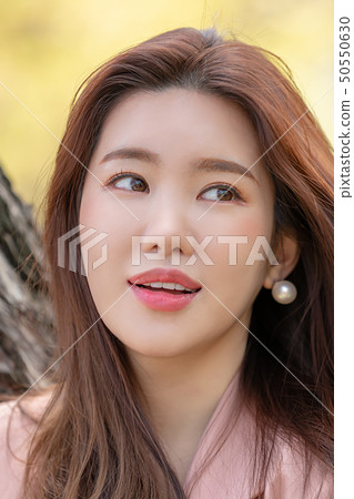 A woman enjoying a happy everyday scene A woman enjoying a happy everyday scene 50550630