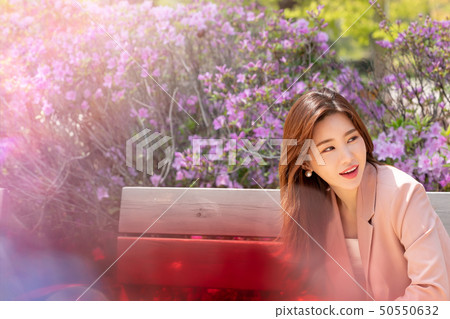 A woman enjoying a happy everyday scene A woman enjoying a happy everyday scene 50550632