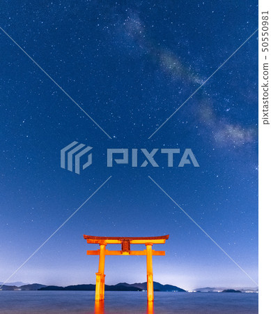 Torii standing on the Milky Way and the lake 50550981
