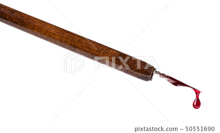 red ink drop on tip of nib of brown dip pen red ink drop on tip of nib of brown dip pen 50551690