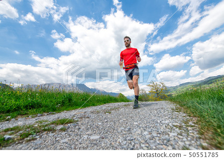 Training of a mountain marathon runner on country Training of a mountain marathon runner on country 50551785