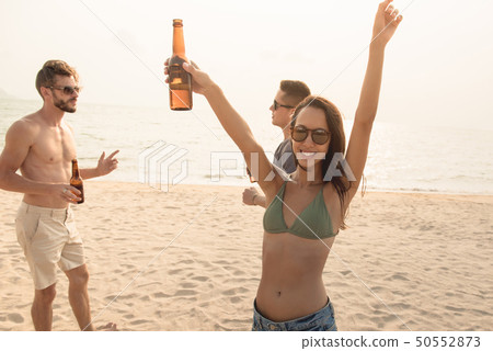 Group of friends having party at the beach Group of friends having party at the beach 50552873