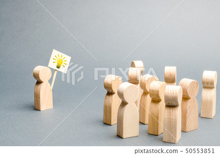 A man with a poster with a picture of the bulb 50553851