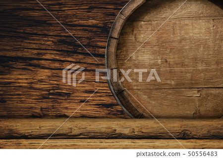 Wooden barrel and worn old table of wood. Wooden barrel and worn old table of wood. 50556483