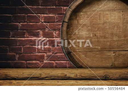 Wooden barrel and worn old table of wood. 50556484