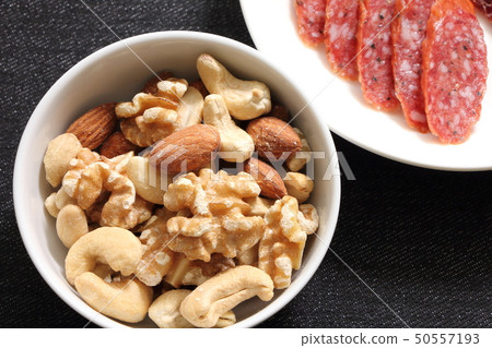 A snack image with a focus on mixed nuts. A snack image with a focus on mixed nuts. 50557193