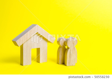 Figures of the family and house on a yellow 50558230