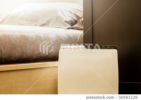 Air purifier in the bed room cleaner removing fine dust in house. 50561126