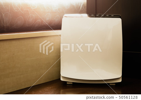 Air purifier in the bed room cleaner removing fine dust in house. 50561128