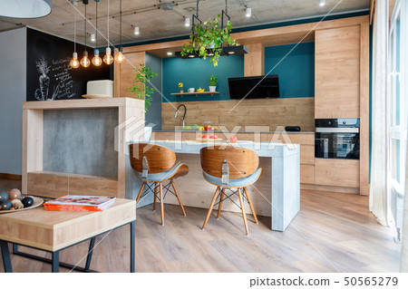 Modern furniture in luxury kitchen. Minimalist scandinavian interior in loft apartment with wooden 50565279