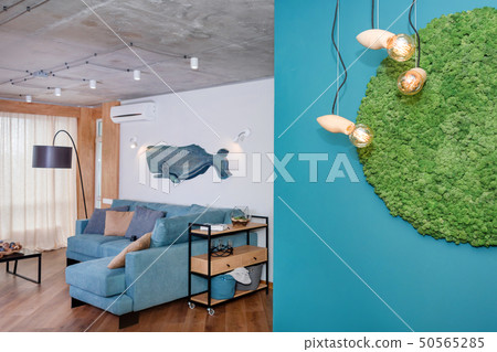 Minimalist modern living room with sofa in loft style flat. Modern loft studio with a kitchen and Minimalist modern living room with sofa in loft style flat. Modern loft studio with a kitchen and 50565285