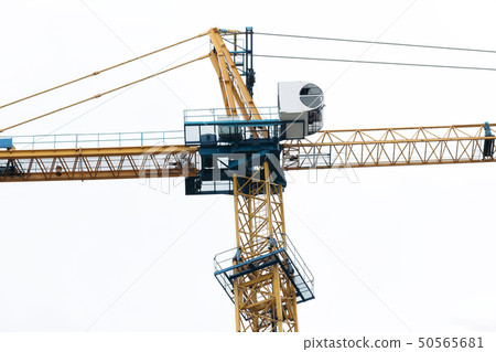 construction yellow crane against the sky. 50565681