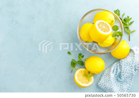 Sliced and whole lemons with mint Sliced and whole lemons with mint 50565730