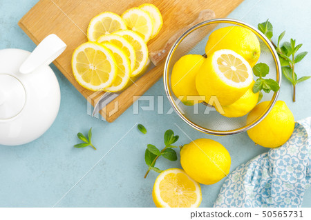 Sliced and whole lemons with mint Sliced and whole lemons with mint 50565731