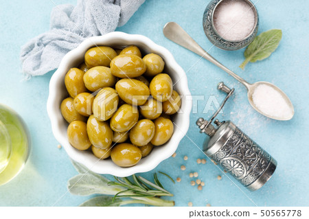 Green olives in a bowl 50565778