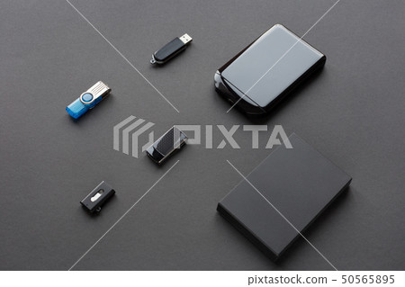 Modern flash drives and external hard disks. Modern flash drives and external hard disks. 50565895