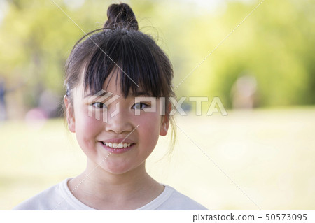 Kid playing outside 50573095