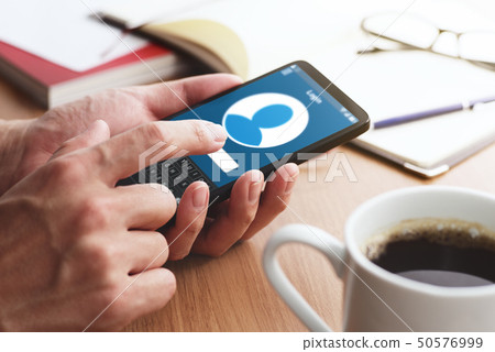 Up of male hand to log in by tapping on the smartphone. 50576999