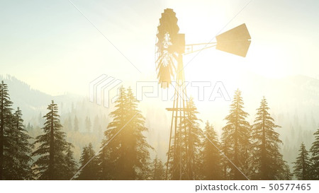 Typical Old Windmill turbine in forest at sunset Typical Old Windmill turbine in forest at sunset 50577465