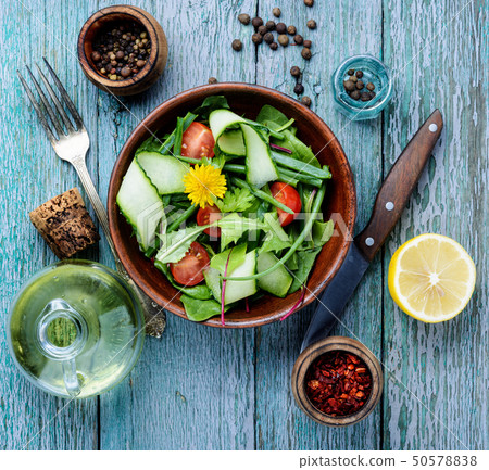 Spring salad with dandelions 50578838