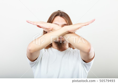 Man making stop sign Man making stop sign 50579493