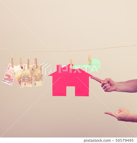 Male hands showing house and money Male hands showing house and money 50579495