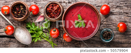 Tomato soup on wooden table 50579904