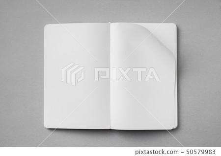 white notebook with turn page on grey background white notebook with turn page on grey background 50579983